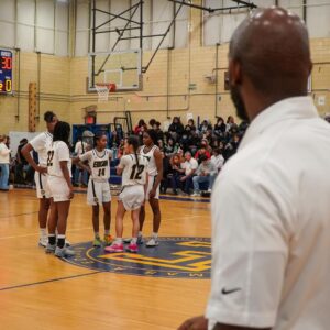 Omezie coaches girls basketball team 