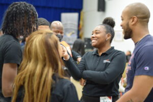 Jerron, alumni, speak with Peer Leaders